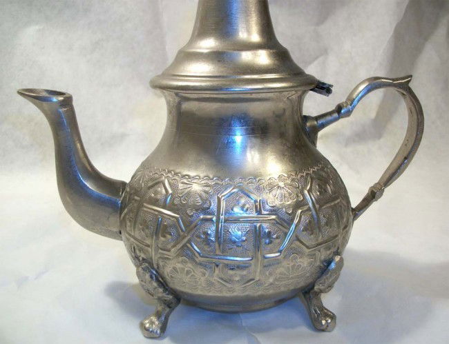 ORNATE PERSIAN SILVER TEAPOT DELICATE INTAGLIO: Signature under bottom. 8 1/2" tall by 3 3/4" wide.