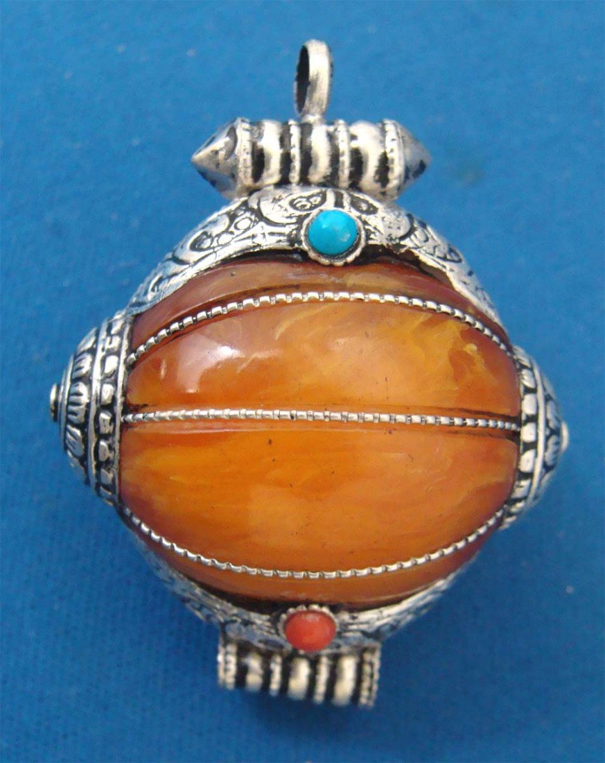 Nepalese Beeswax Pendant: Dimensions: 2" by 1.5"