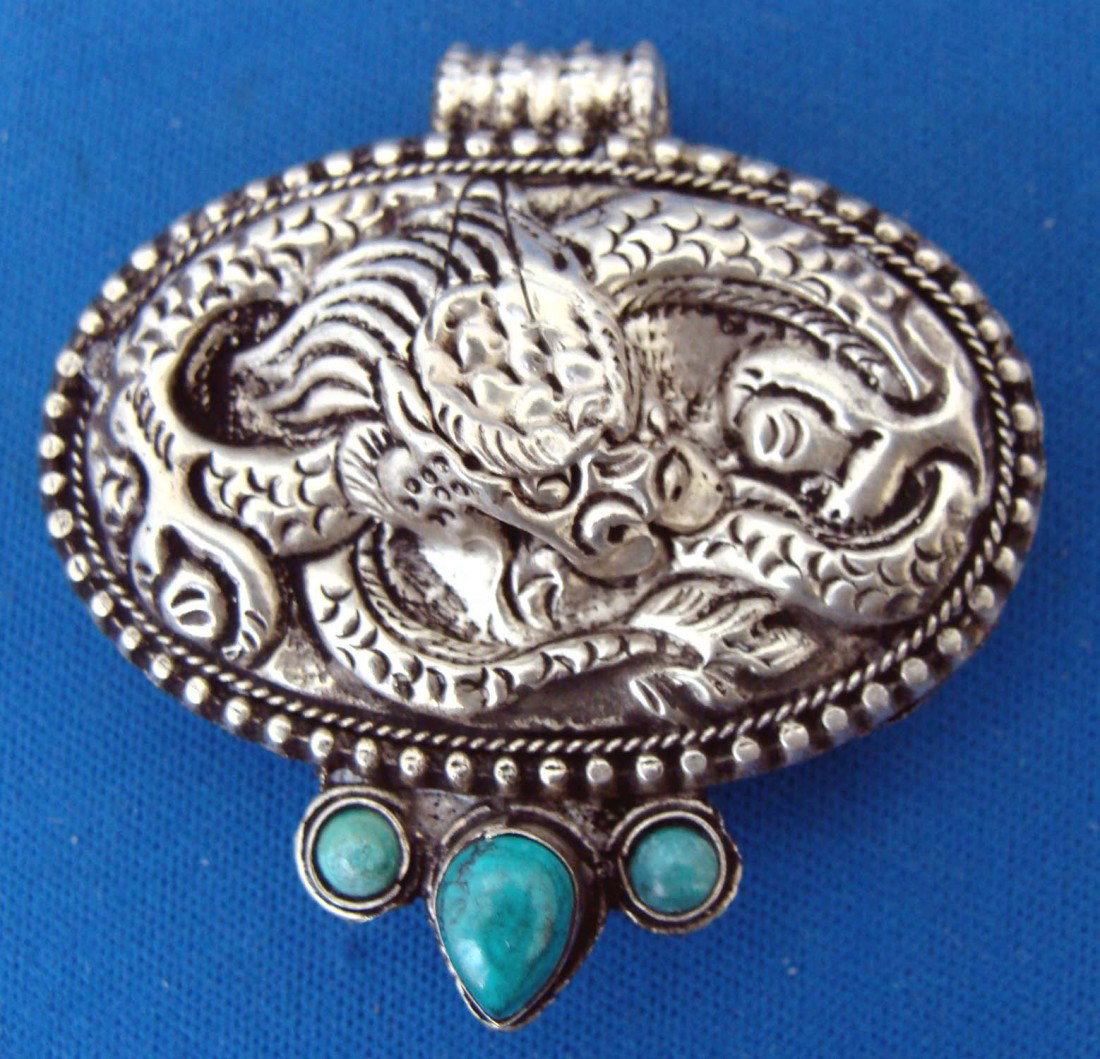 Nepalese Sterling Silver with 3 turquoise Beads Gau: Dimensions: 2" by 2"