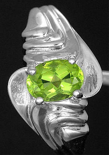 1.0 ct Natural Green Peridot .925 Sterling Silver Ring: Ring size 7 1/2 LGK7W5 Gemstone : Natural Peridot Weight 1.0 Carat Shape :Oval - 7x5mm Color / Clarity :Green / Eye Clean Origin / Treat :Africa / 100% Natural Untreated