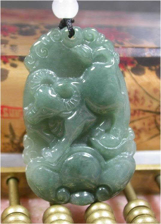 Green Natural A JADE PENDANT Ox Ruyi Lotus flower: 100% Natural A jadetie, heat enhanced for color, 37 mm X 24 mm X 6 mm AJK18W