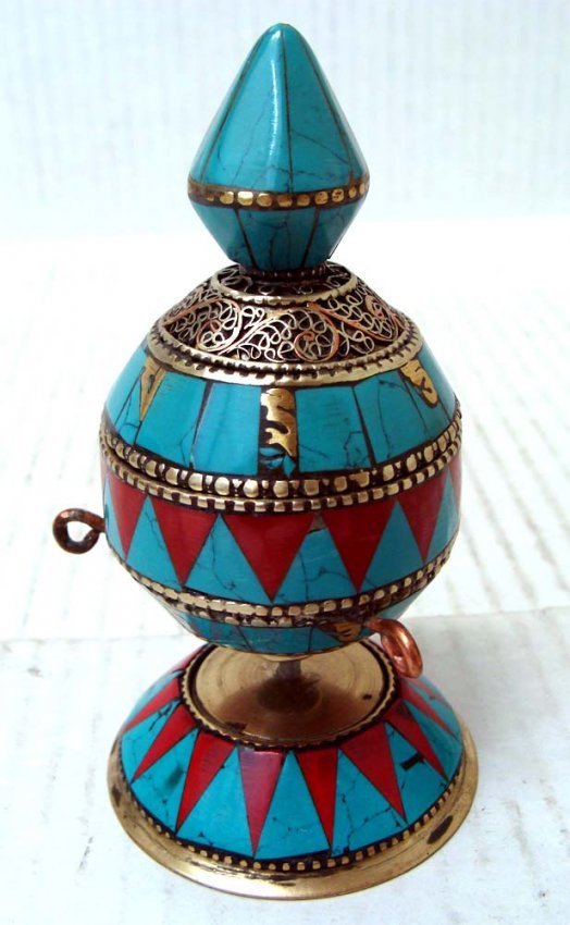 Tibetan Table Prayer Wheel Turquoise, Coral Silver: A prayer wheel is a holy object containing the Tibetan mantra "Om! Mane Padme Hum!" ("Hail! Jewel in the Lotus!") written many times on a scroll of paper rolled up inside. Dimensions 5" by 2.5" old#30