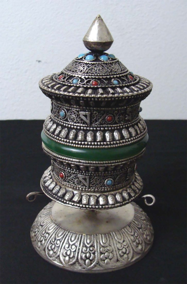 Nepal Tibetan Table Prayer Wheel with Green jade Bangle: A prayer wheel is a holy object containing the Tibetan mantra "Om! Mane Padme Hum!" ("Hail! Jewel in the Lotus!") written many times on a scroll of paper rolled up inside. Dimensions 6.5" by 4" TAK1W5