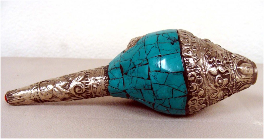 Nepalese Ritual Conch Shell Inlaid Turquoise Lapis silv: This unusual and wonderful Ritual Conch Shell is beautifully carved with semi precious stones and silver. Dimensions: 6" by 2.5" K8W5