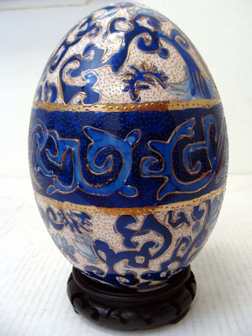 Chinese Blue Porcelain Enameled Egg Dragon Design: NO RESERVE! Decorated with raised enamel colors all around the egg, dimensions 8" tall + wood base