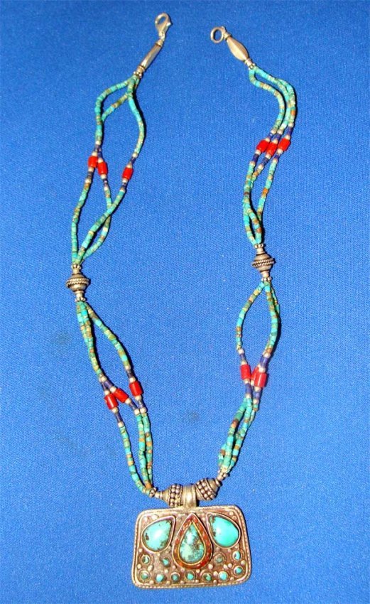 Tibetan Sterling Silver Turquoise Necklace Nepal 16": Numerous turquoise, coral and lapis beads are set in a sterling silver pendant, the necklace consists of Turquoise, coral lapis and silver beads. Pendant is 2" wide, Necklace length 16". K24W2