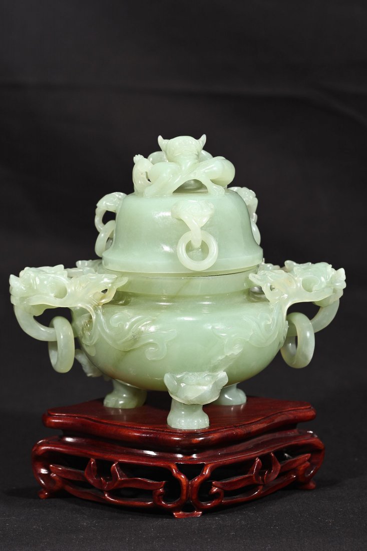 CHINESE CARVED SERPENTINE JADE CENSER: HAVING DRAGON HANDLES, AND DRAGON LID. Dims 6" H X 7" W, wood base 2" H DB057