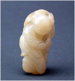 Chinese antique carved white jade toggle: Depicting a boy carrying lotus. Circa 18th-19th C. dimensions: 2.25" H K101W