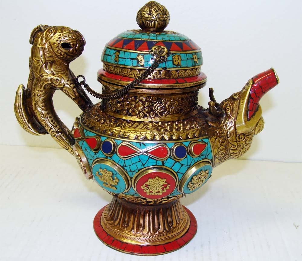 Large Ceremonial Nepal Dragon & Fu Dog Teapot: Fu Dog Handle and a Dragon Spout, coated with a mosaic decoration of Lapis, Carnellian, Coral and Turquoise, on a Etched Brass Base. Dimensions 8" by 9" K10W51
