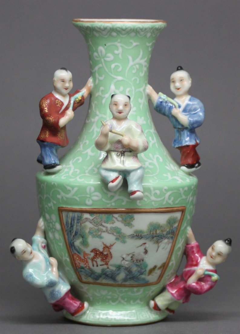 CHINESE ANTIQUE FAMILLE ROSE PORCELAIN WALL VASE: DEPICTING DEERS AN CRANES ON A LANDSCAPE. HAVING FIVE BOYS AROUND THE VASE. SIX CHARACTER MARKED. Dims 6 3/4" H X 4 3/4" W, DB514