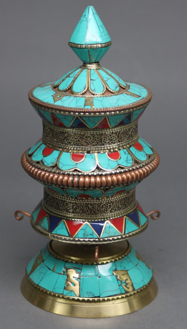Nepal Desk Prayer Wheel Turquoise Lapis & Carnelian: A prayer wheel is a holy object containing the Tibetan mantra "Om! Mane Padme Hum!" ("Hail! Jewel in the Lotus!") written many times on a scroll of paper rolled up inside. Dimensions: