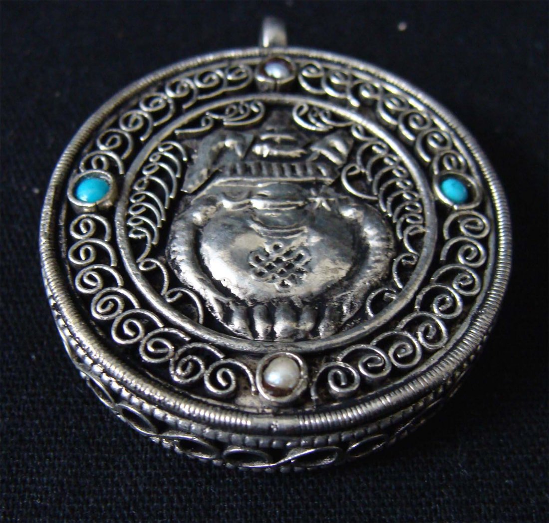 Nepal Gau Pendant Filligree with Turquoise: Traditional Gau Pendant from Tibet, elegant and generously-sized Tibetan pendant from Nepal. Included is a beautiful and genuine Turquoise gem-stone, set into nickel silver. There is intricately detai