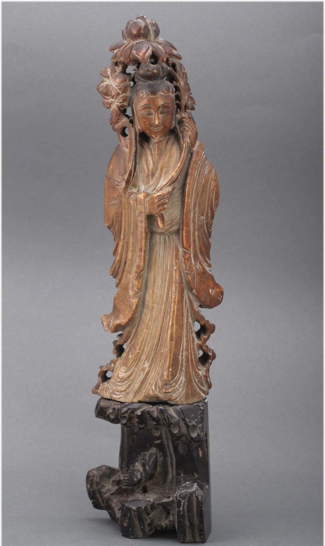 Chinese antique carved soapstone Guanyin figure: Holding a lotus, standing on a rock. Circa 19th C. dimensions: 14.25" H by 3.75" wide K077W