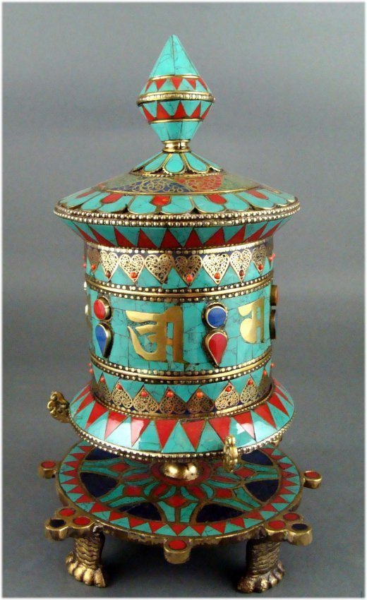 Nepal Prayer wheel on Table stand Turquoise & Coral: A prayer wheel is a holy object containing the Tibetan mantra "Om! Mane Padme Hum!" ("Hail! Jewel in the Lotus!") written many times on a scroll of paper rolled up inside. Dimensions 11.5" by 6.5" old