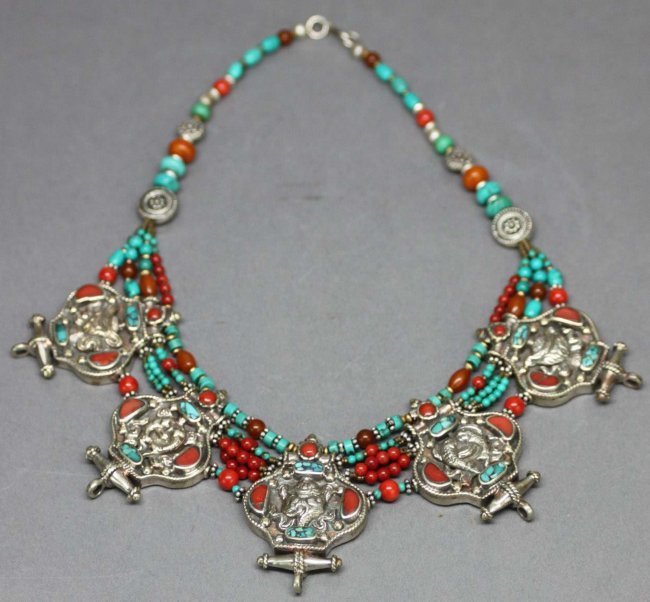 Nepalese Silver Necklace with 5 Gau Pendants & Coral: Each silver pendant has a relief of a sacred object, the necklace is accented with coral, turquoise and quartz beadwork, 15" long, 2AF142 K3W01