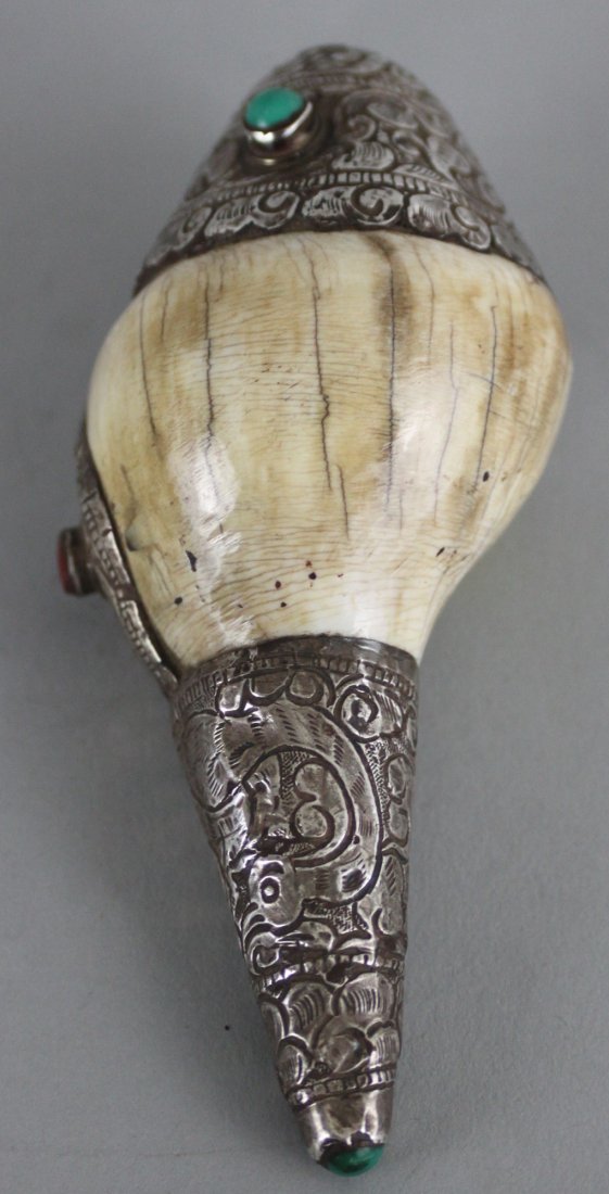 Nepalese Ritual Conch Shell: This beautiful Ritual Conch Shell is carved with silver and semi precious stones . Dimensions 5.5" x 2.5", CS1, K4W55, CS8, K1W51