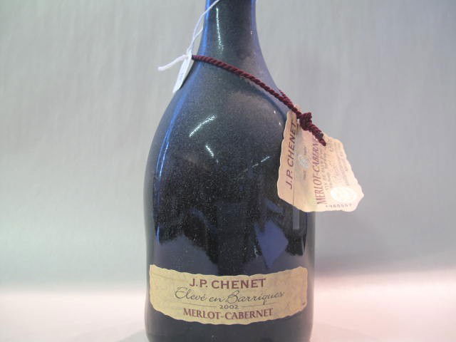 J.P. Chenet Merlot Cabernet 2002: This wine bottle will be sold in auction with S.A.Q.approbation. Note: All wine bottles value were upraised $100-$200, even if they are worth more or less. We all start them at $10, because these bott