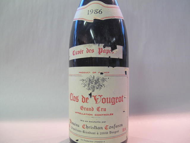 Clos de Vougeot Grand Cru 1986: This wine bottle will be sold in auction with S.A.Q.approbation. Note: All wine bottles value were upraised $100-$200, even if they are worth more or less. We all start them at $10, because these bott
