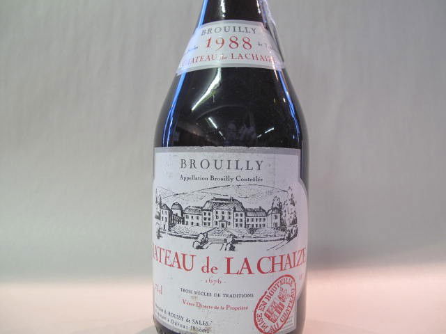 Château de La Chaize, Brouilly 1988: This wine bottle will be sold in auction with S.A.Q.approbation. Note: All wine bottles value were upraised $100-$200, even if they are worth more or less. We all start them at $10, because these bott