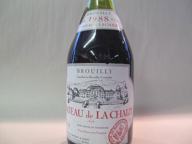 Château de La Chaize, Brouilly 1988: This wine bottle will be sold in auction with S.A.Q.approbation. Note: All wine bottles value were upraised $100-$200, even if they are worth more or less. We all start them at $10, because these bott