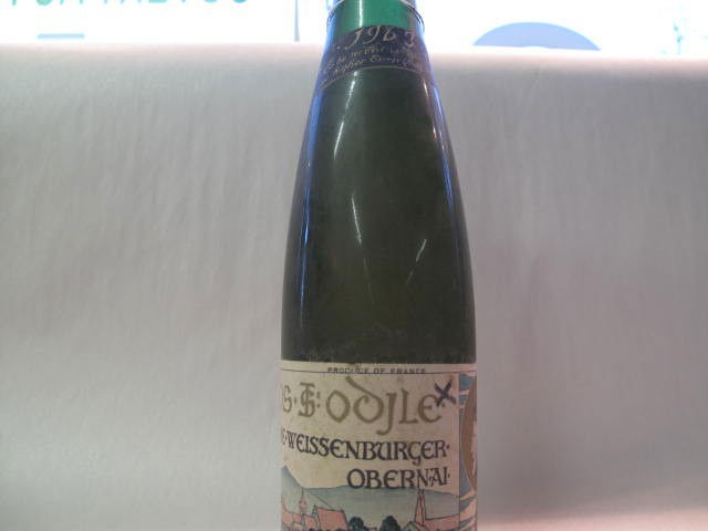 Pierre-Weissenburger Obernai, Clos Ste-Odyle 1963: This wine bottle will be sold in auction with S.A.Q.approbation. Note: All wine bottles value were upraised $100-$200, even if they are worth more or less. We all start them at $10, because these bott