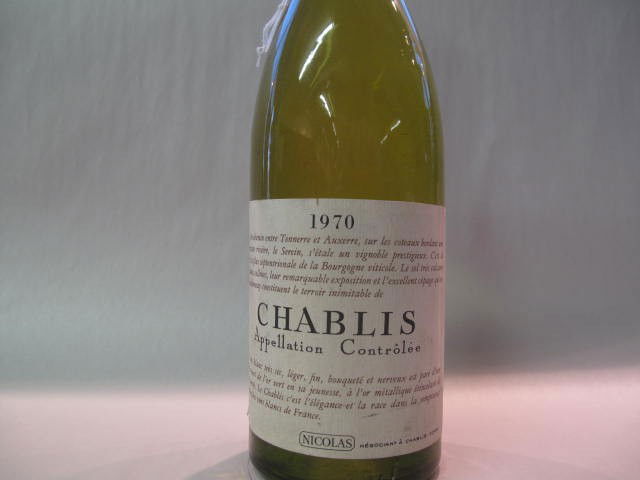 Chablis Nicholas 1970: This wine bottle will be sold in auction with S.A.Q.approbation. Note: All wine bottles value were upraised $100-$200, even if they are worth more or less. We all start them at $10, because these bott