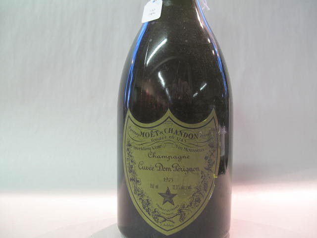 Don Pérignon, 750 ml 1975: This wine bottle will be sold in auction with S.A.Q.approbation. Note: All wine bottles value were upraised $100-$200, even if they are worth more or less. We all start them at $10, because these bott