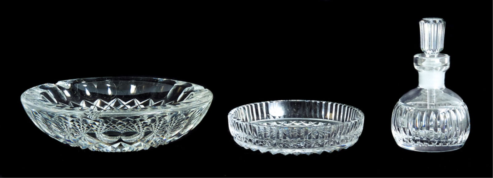 3 Pcs Waterford Crystal Table Accessories: Three pieces of Waterford crystal comprising a large heavy ashtray in Colleen pattern, a perfume or scent bottle with dauber and circular pin tray or dish.