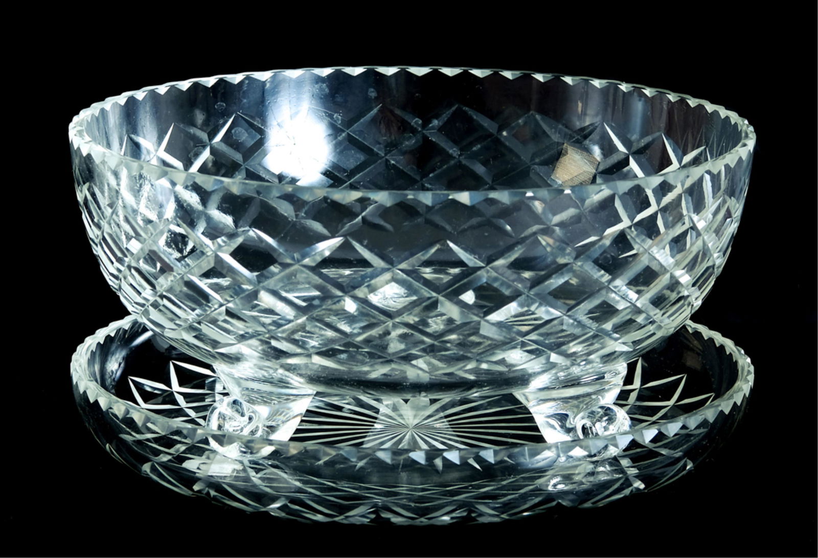 Group, 4 Pcs Cut Crystal Table Accessories: Group of four pieces of cut crystal, in the manner of Waterford, comprising a pair of 10.75" candlestick holders, a footed bowl and circular shallow bowl or dish. Apparently all unmarked. Approx. heig