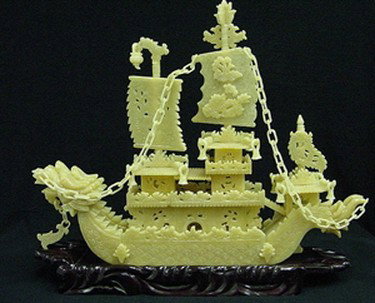 24" Yellow Jade Dragon Boat : This Boat Is Made From Natural Yellow Jade. It Is All Hand Carved. It Consists Of Boat Body, Parts And Wooden Base. There Are 2 Dragons On The Boat. Very Detailed Carving.