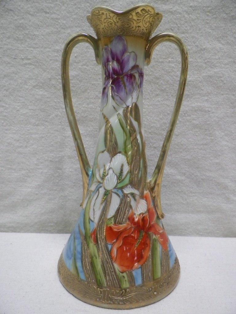 Nippon Vase Multicolored Iris: C 1900. 10" Tall 5-1/8"W. Repair to one handle and gold loss to handles.