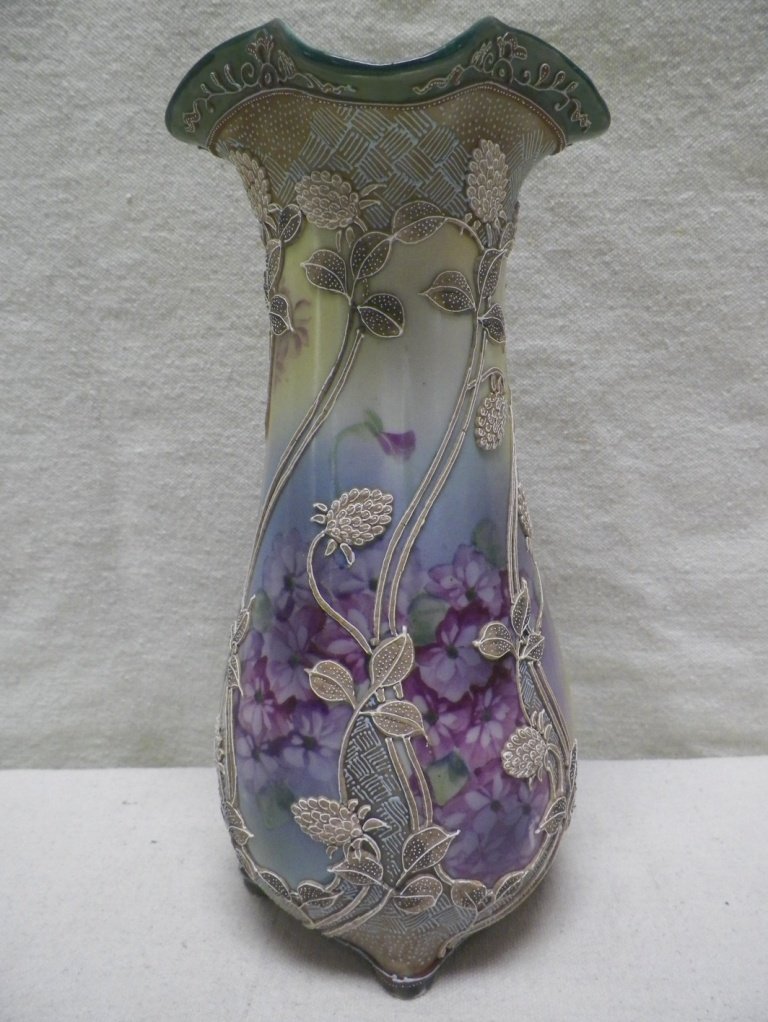 Nippon Moriage Vase Violets Maple Leaf Mark: C 1900. 10" Tall 4.25"W. Few small pieces of Moriage missing.