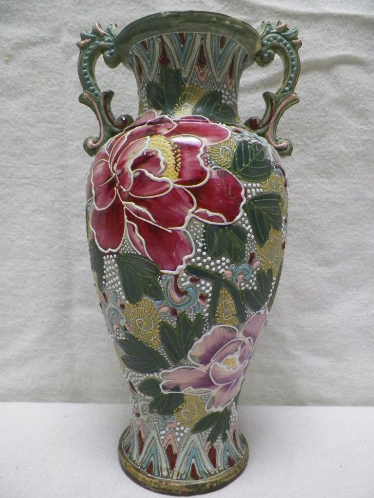 Nippon Moriage Vase-Unmarked: C 1910. 13-3/8" Tall 6.75"W Handle to Handle. Few minor pieces of Moriage missing and light rubs. Drilled at bottom to be used as a lamp.