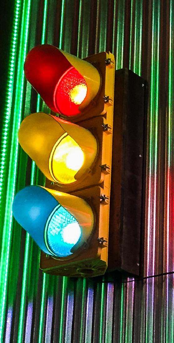 Stoplight: Yellow body with red, yellow, green lights.