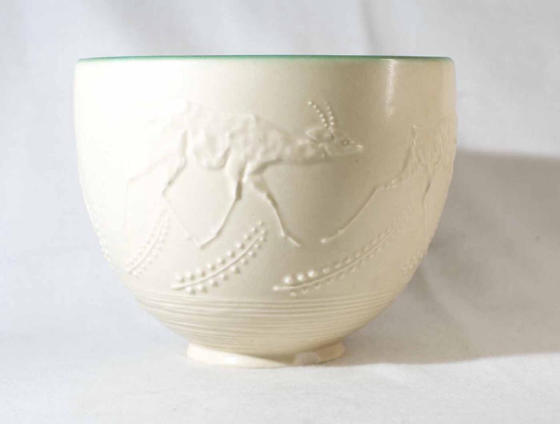 Rookwood Bowl: (1) approx. 5 3/8"h x 6 3/4"dia. White with green interior. African horned animal. #6052. Date: 1928.