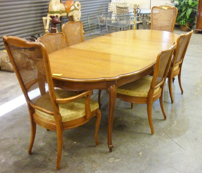 Dining Room Table and Chairs: Mid 20th century. White Furniture Company. Walnut with a natural patina. (1) Oval table, (6) Side chairs