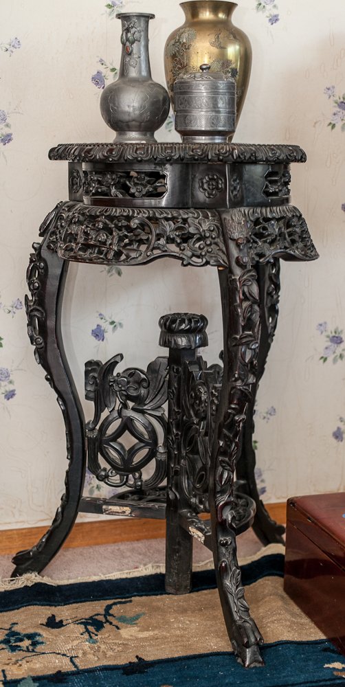 Oriental Plant Stand: (1) 32" h, 18" dia. Early 20th century, Oriental. Heavily carved wood frame with a ebonized finish and a marble inlaid top. Shipping: Pickup only. Neale and Sons will not ship this item. The buyer is 