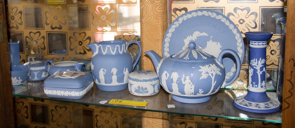 Wedgwood & Other Jasperware: (11 pc) Total. Blue and white. Including: (1) pitcher, (1) candlestick, (1) plate, (1) teapot, (3) covered dishes, (1) pitcher, (1) creamer, (1) bowl, (1) wall sconce. Shipping: USPS or Fedex. $90.00.