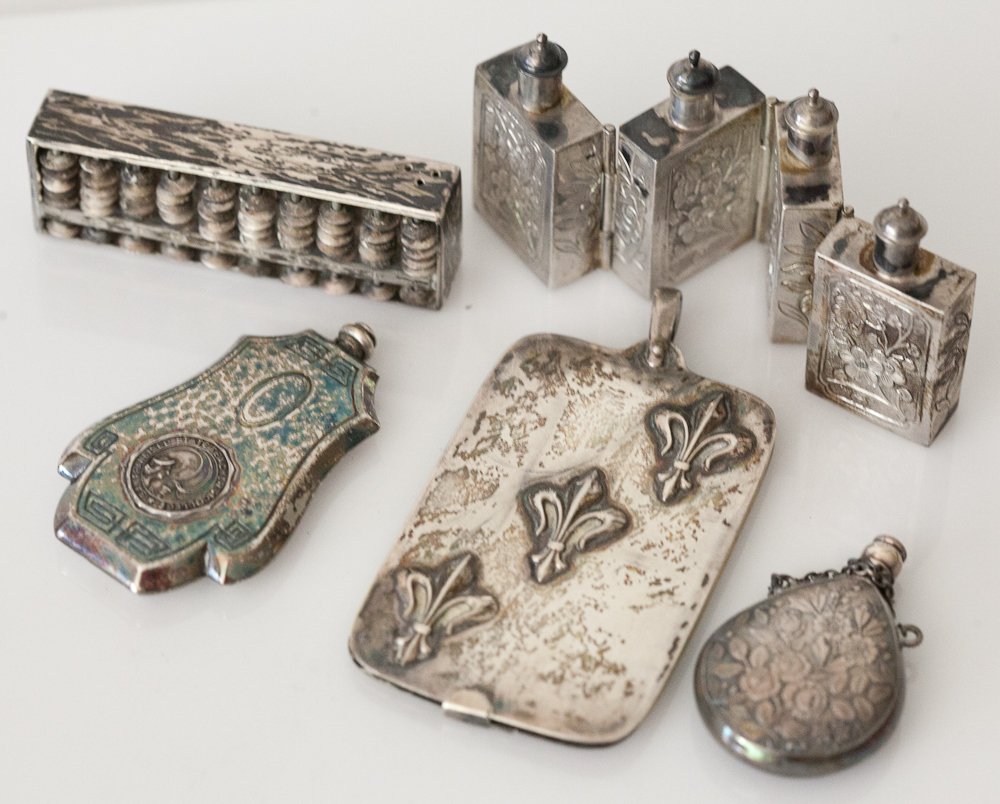 Sterling Silver Miniature Vanity Items: (5pc) Total. Including: (1) four folding snuff box, includes four linked snuff bottles with Chinese touch marks and (1) pill box, shaped as an abacus with hidden pill box compartment. (2) perfume bott