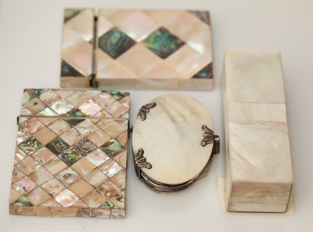 Mother of Pearl Grouping: (4 pc) Total. Including: (2) cigarette cases, (1) Magnifying glass with a silver case and mother of pearl seashell and (1) stamp box. Shipping: USPS or Fedex. $25.00. We will ship internationally for 