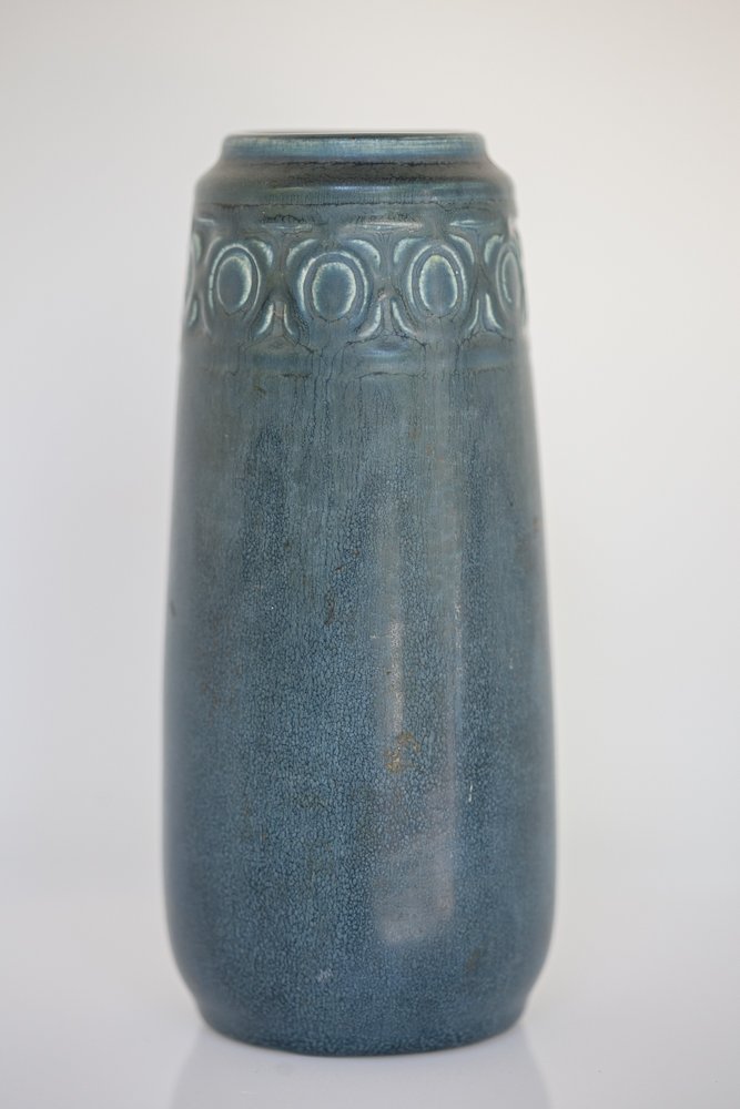 Rookwood 1918 Vase: (1) 9"h. Blue finish with Grecian boarder. Marked on base: Roman numeral: XVII (1913) Body type: 2315. V: for a Vellum finish introduced in 1904. With a paper label written by a previous owner. Shippi