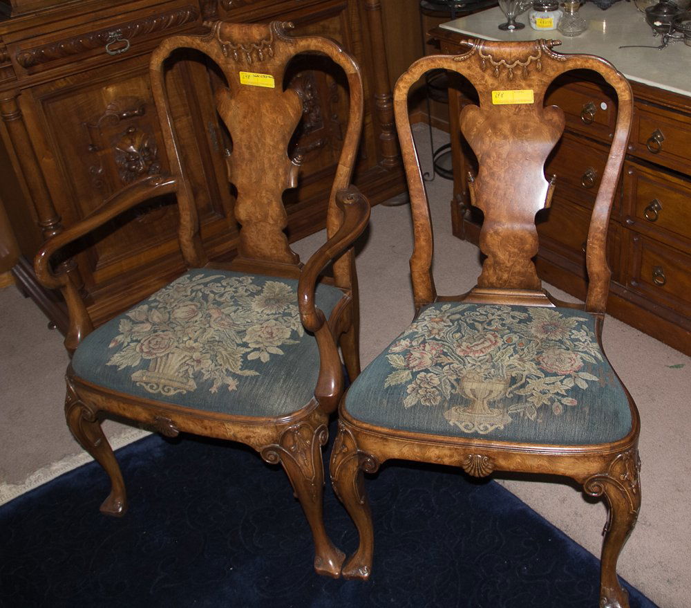 Georgian Styled Dining Room Set: 20th century, walnut and burl wood. Including: (1) 64" Dining room table, cabriole leg. Includes one leaf; (2) Armchairs, spoon back with needlepoint seats; (6) Side chairs, spoon back with needlepoin