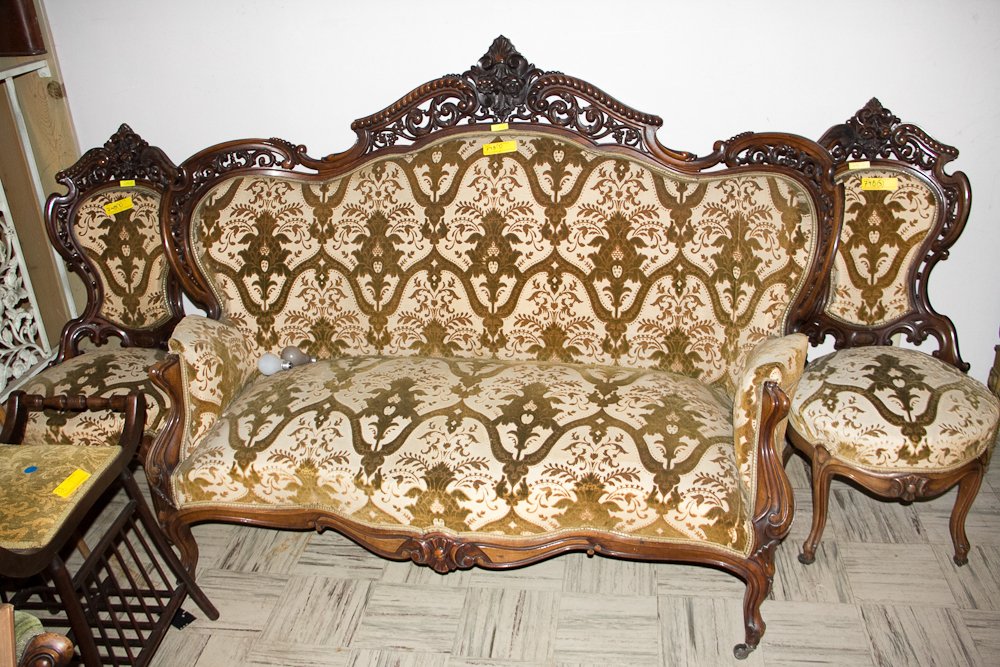 Victorian Parlor Set: (3) Pcs. Circa 1875. American. (Resembling Belter). Including: (1) Settee, 65", Open lattice carved camel back with a centered architectural floral design. Set on cabriole legs. Reupholstered circa 19