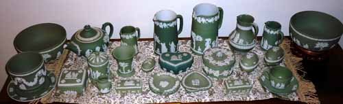 Wedgwood Jasperware Collection: (27 pc) Light green and white jasperware. Including: (1) 8 1/2"dia. Bowl, Cup and saucers, Lidded boxes, Pitchers, Teapot, etc.