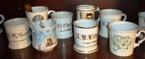 Antique Shaving Mugs: (8) Total. Ceramic and porcelain. Including: (4) personalized, (1) transfer print of cowboy, (1) Spode with green floral design, (1) Col. Ichabod Conk, (1) Doc Holiday.