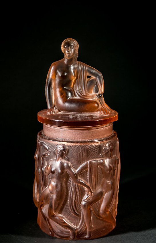 Heinrich Hoffman Lidded Pink Glass Bowl: (1) 12"h. Czech, Heinrich Hoffman, Art deco. Pink glass with art deco stylized dancing nudes. Lidded with reclining nude female. Heinrich Hoffman Open Butterfly mark.