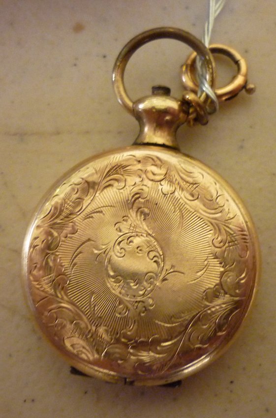 Gold Locket: (1) 14K yellow gold. 1"dia. With engraved city scene.