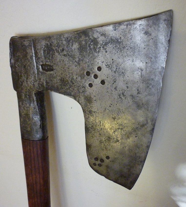 Hewing / Goosewing Broad Axe: (1) Antique, Hewing / Goosewing Broad Axe. 47" total length. 10 1/2" x 9 1/4" head. There is a incised mark on the head of a sword. Oak long handle. Possibly Swedish or German.