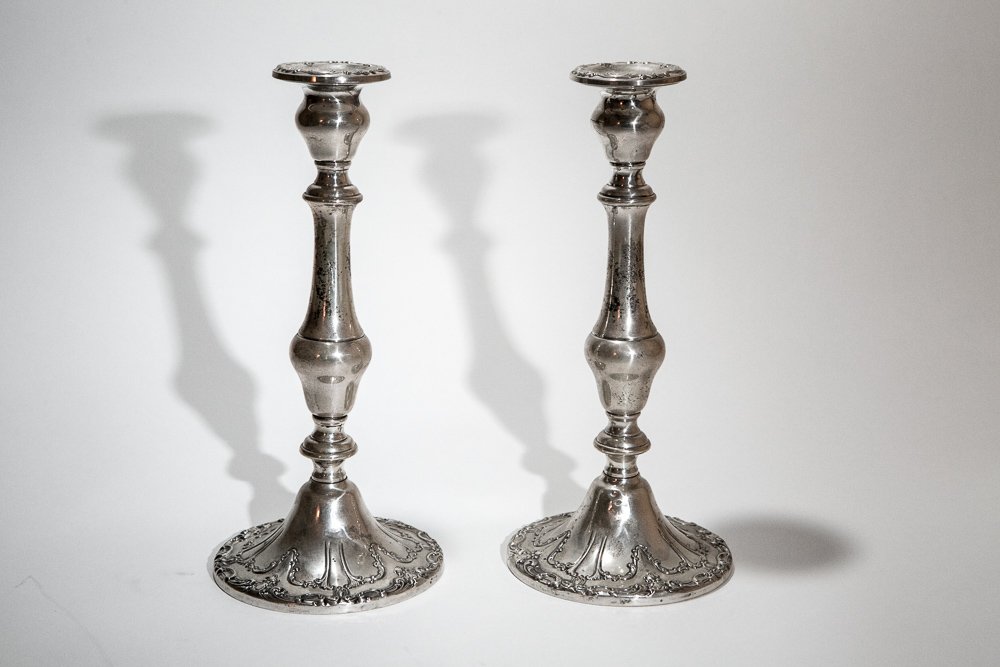 (2) Gorham Sterling Silver Candle Holders: Gorham Co. Weighted sterling silver, triple fount. NOTE: These two candlesticks match Lot #299. Marked on bottom: Gorham Co. #750. Dimensions: 9 ½" high x 4 ½" diameter base.