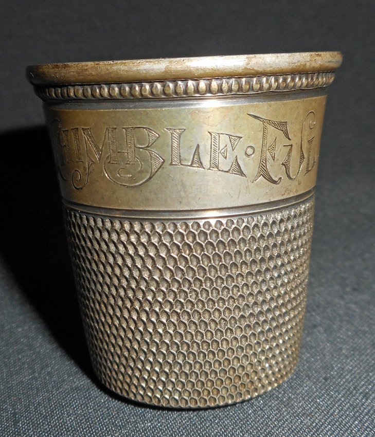Sterling Silver Jigger. Only A Thimble Full: American. Early 20th Century. Sterling silver jigger. Engraved: Only A Thimble Full. Marked: Sterling. Dimensions: 1 7/8" high x 1 3/4" wide at base. Weight: 1.2 oz. troy.